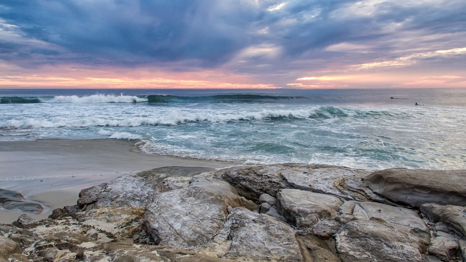 A view of the ocean from a rocky beach